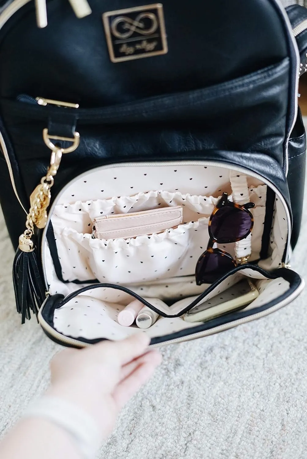 Itzy Ritzy Chelsea   Cole Diaper Bag Backpack - Studded Boss Backpack Diaper Bag Includes 19 Pockets, Changing Pad, Stroller Clips & Tassel; Black with Sweetheart Print Interior & Gold Hardware