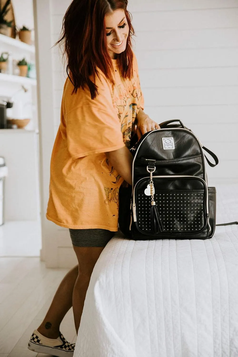 Itzy Ritzy Chelsea   Cole Diaper Bag Backpack - Studded Boss Backpack Diaper Bag Includes 19 Pockets, Changing Pad, Stroller Clips & Tassel; Black with Sweetheart Print Interior & Gold Hardware